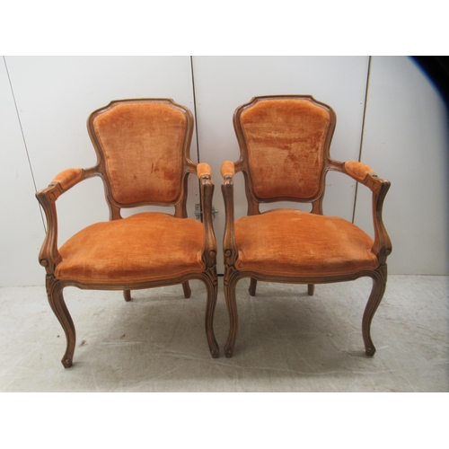 11 - A pair of modern French antique inspired, stained beech framed and fabric panelled, open arm salon c... 