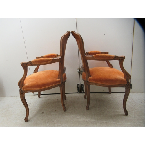 11 - A pair of modern French antique inspired, stained beech framed and fabric panelled, open arm salon c... 