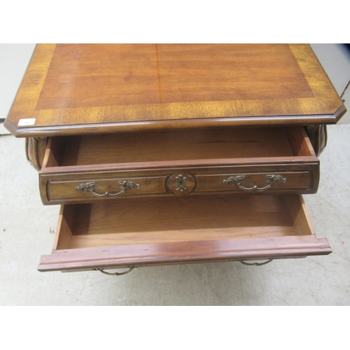 25 - A modern American cherrywood, two drawer dressing chest, raised on stubby cabriole legs  21