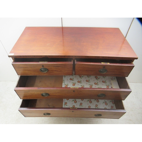 4 - An early 19thC mahogany dressing chest with two short/three graduated long drawers, raised on bracke... 