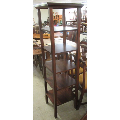 278 - A modern mahogany finished, six tier display stand, raised on square supports  65