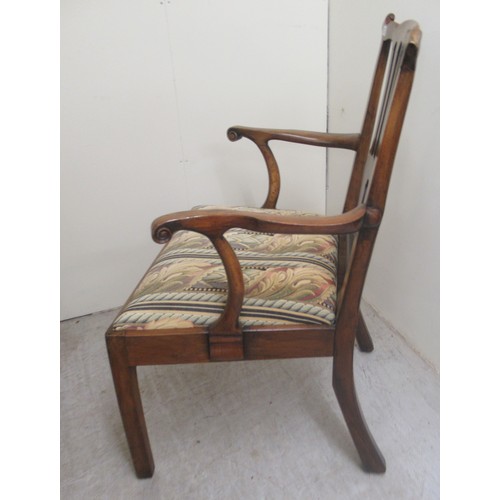 26 - A George III walnut framed, pierced splat back elbow chair, the drop-in seat raised on square forele... 