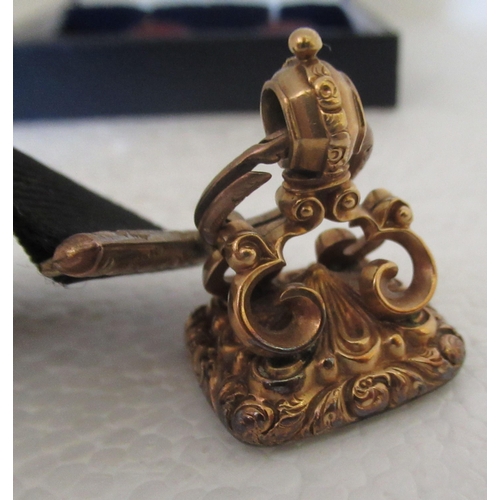 107 - Jewellery: to include a late Victorian yellow metal fob seal