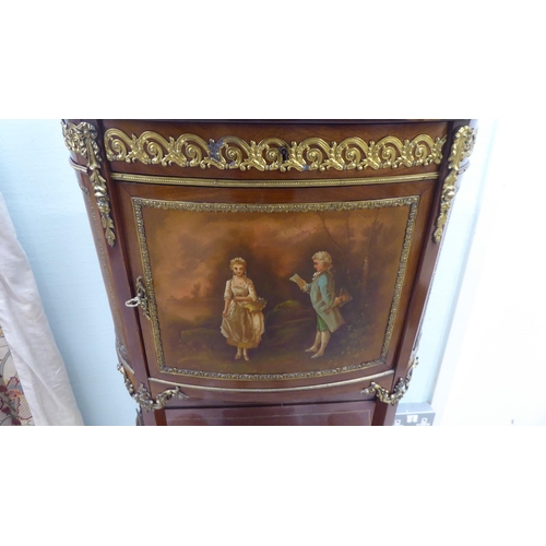 122 - A 20thC reproduction of a 19thC French side cabinet with a pierced brass gallery border, over a faux... 