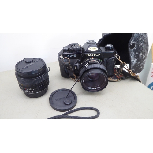 128 - Photographic equipment and accessories: to include a Cannon EOS 100 camera and a Yoshika FX-3 camera... 