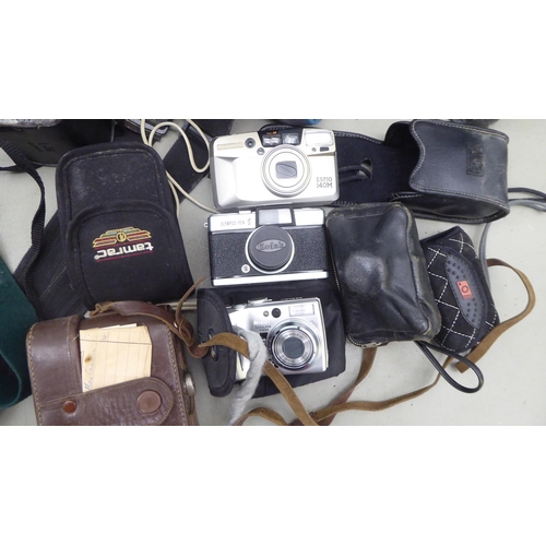 128 - Photographic equipment and accessories: to include a Cannon EOS 100 camera and a Yoshika FX-3 camera... 