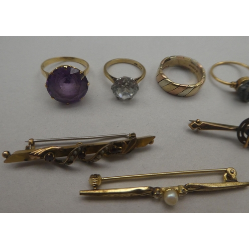 135 - Gold and yellow metal items of personal ornament: to include bar brooches and a 9ct bi-coloured gold... 