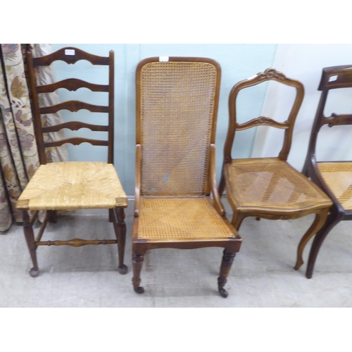 141 - Four 19thC and later chairs: to include a Regency crossbanded mahogany bar back example with a woven... 