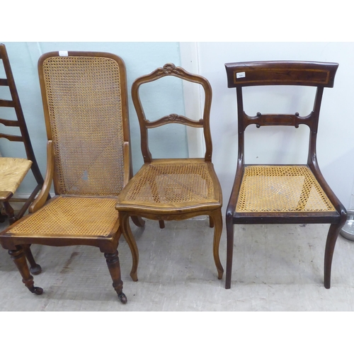 141 - Four 19thC and later chairs: to include a Regency crossbanded mahogany bar back example with a woven... 