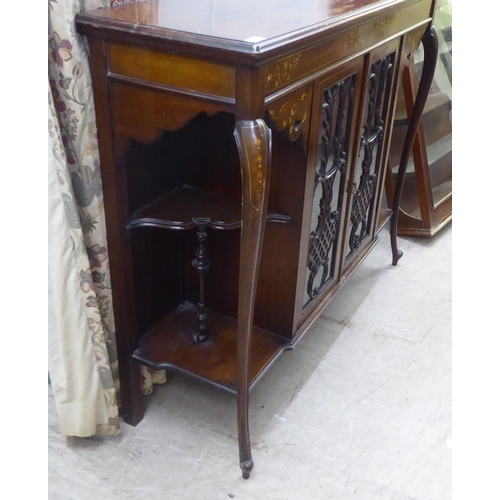 155 - An Edwardian mahogany sideboard with a pair of central glazed doors, flanked by open sections, raise... 