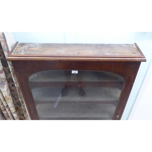 156 - A late Victorian mahogany display cabinet with a full height glazed door, on a plinth  52