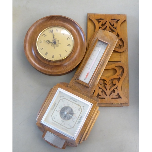 158 - 20thC wooden and other collectables: to include an Edwardian oak cased aneroid barometer  21