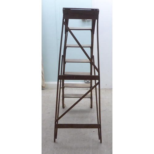 162 - A mid 20thC beech, seven tread, folding step ladder