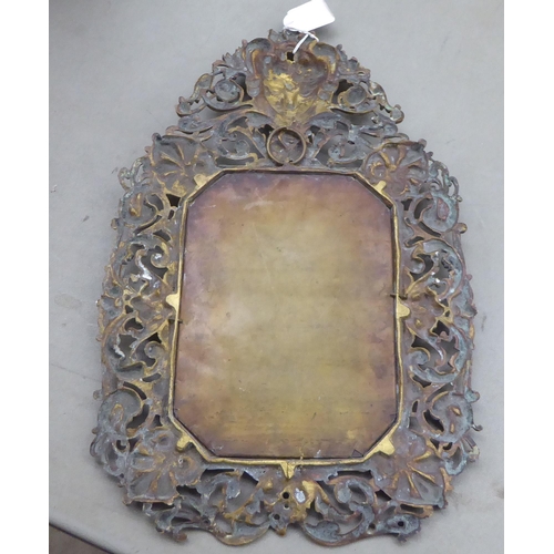 163 - 19thC and later metalware: to include an ornately cast brass mirrored frame  14