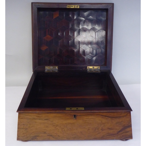 17 - A Regency rosewood box of sarcophagus form with a hinged lid, on flat bun feet  5.5