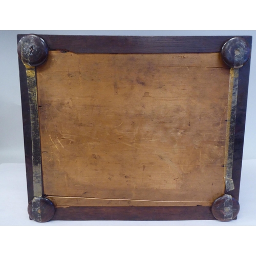 17 - A Regency rosewood box of sarcophagus form with a hinged lid, on flat bun feet  5.5