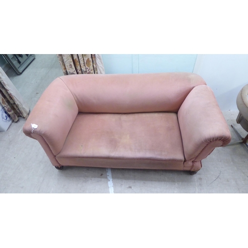 190 - A late Victorian fabric upholstered drop-end Chesterfield, raised on turned feet  66