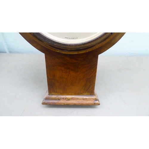 197 - A Harrods walnut cased aneroid barometer with a thermometer and circular dial  34