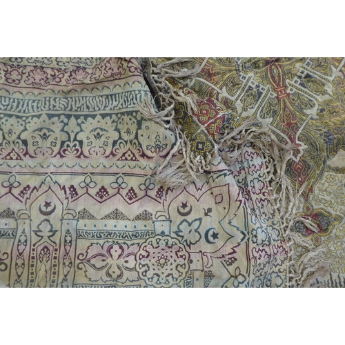 233 - A North African shawl, decorated with stylised designs and tasselled ends