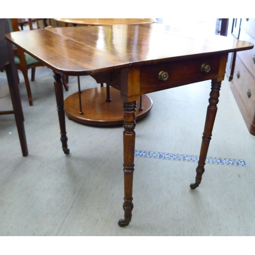 234 - A George III mahogany Pembroke table, raised on ring turned legs and casters  28