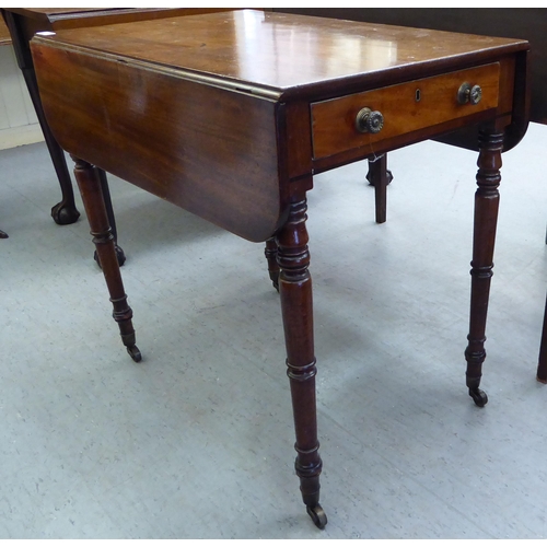 234 - A George III mahogany Pembroke table, raised on ring turned legs and casters  28