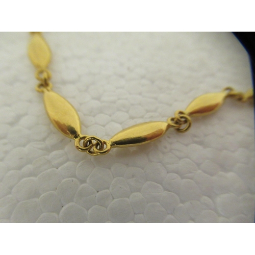 24 - A Chinese 22ct gold oval bar link bracelet