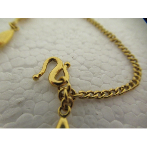 24 - A Chinese 22ct gold oval bar link bracelet