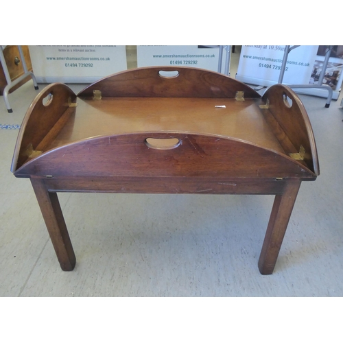 251 - A modern Georgian design mahogany butlers tray design coffee table, raised on square legs  17