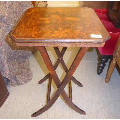 252 - An early 20thC pokerworked occasional table, the decorative top raised on a folding base  24