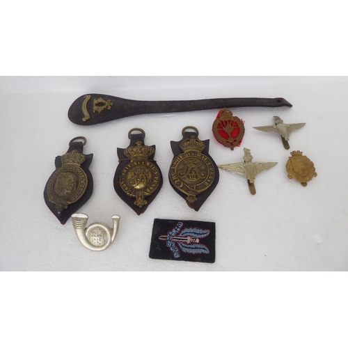 272 - Military and livery horse brasses and cap badges (Please Note: this lot is subject to the state... 