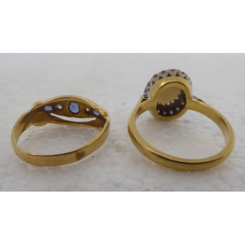 284 - Two 18ct gold rings, set with various coloured stones