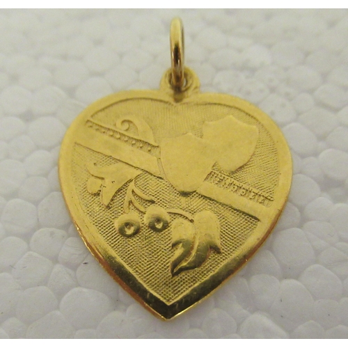 30 - Three Chinese 22ct gold items of personal ornament: to include a heart shaped pendant