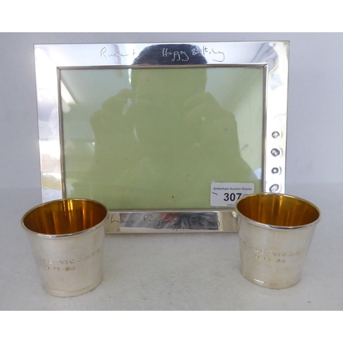 307 - Silver collectables: to include a pair of Tiffany & Co shot beakers with gilded interiors  stamp... 