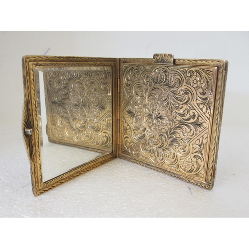 31 - An engraved square, silver gilt coloured metal powder compact, featuring figures in a Venetian scene... 