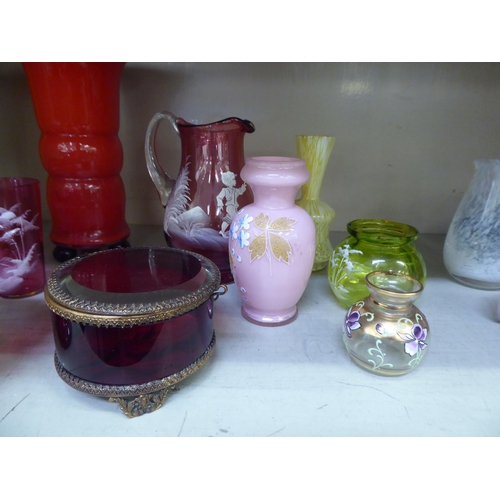 318 - Glassware: to include a Mary Gregory style cranberry coloured cream jug and beaker