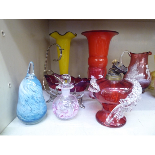 318 - Glassware: to include a Mary Gregory style cranberry coloured cream jug and beaker