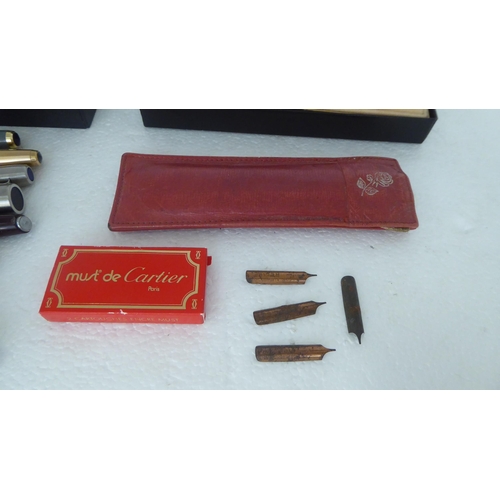 325 - Pens: to include a Must de Cartier rolled gold example  cased 