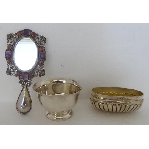 327 - Silver and white metal collectables: to include a preserve spoon  London 2000