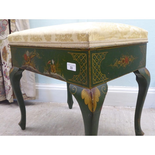 33 - A 1920s chinoiserie decorated green and gilt painted box top piano stool with a hinged lid, raised o... 