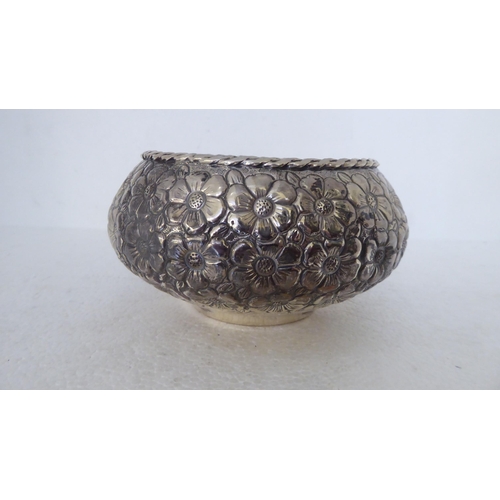 342 - A Continental silver coloured metal bowl with dressed floral decoration  stamped 900  6