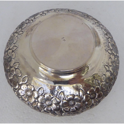 342 - A Continental silver coloured metal bowl with dressed floral decoration  stamped 900  6