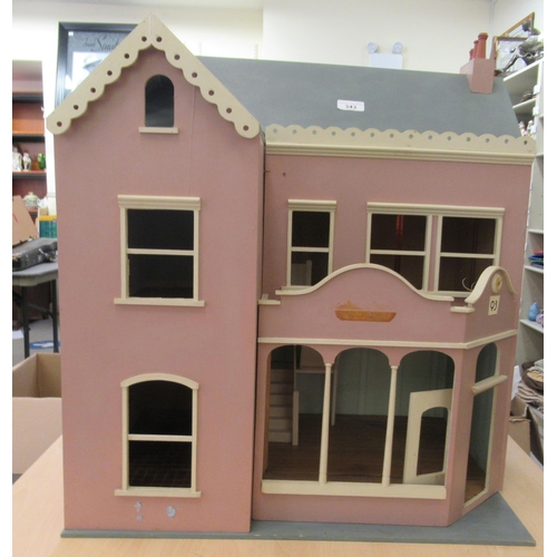 343 - A pink and blue painted dolls house with a double opening front  24