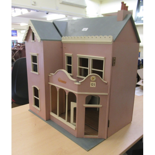 343 - A pink and blue painted dolls house with a double opening front  24