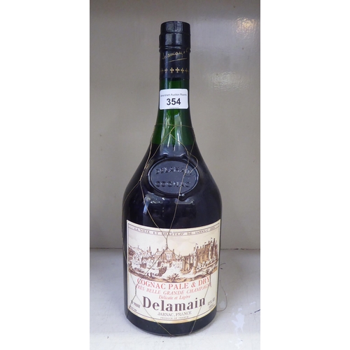 354 - A bottle of Delamain Cognac; and six bottles of port: to include a 1960's Dow's 