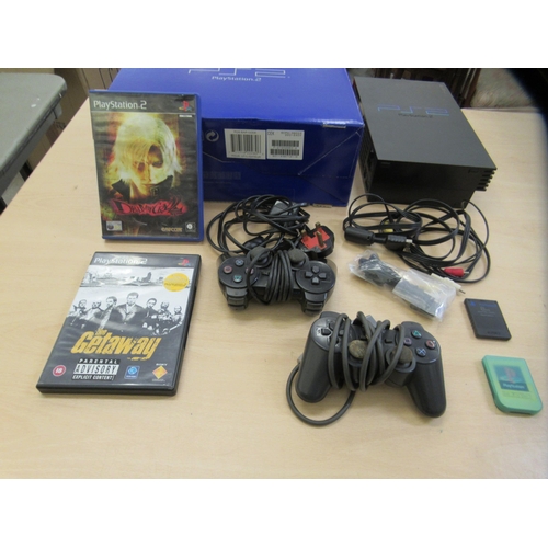 378 - A Sony PlayStation 2 console with two controllers, The Getaway and Devil May Cry 2 games 