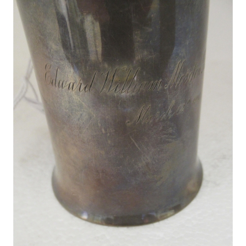 38 - A silver Christening tankard of cylindrical form, on a splayed base with a hollow loop handle  ... 