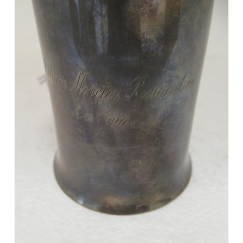 38 - A silver Christening tankard of cylindrical form, on a splayed base with a hollow loop handle  ... 