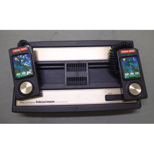 384 - A Mattel Electronics Intellivision games console with Nightstalker and Frog Bog games 