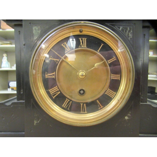 387 - A late Victorian black slate cased mantel clock; the movement faced by a Roman dial  13