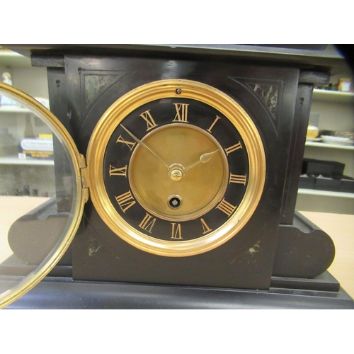 387 - A late Victorian black slate cased mantel clock; the movement faced by a Roman dial  13